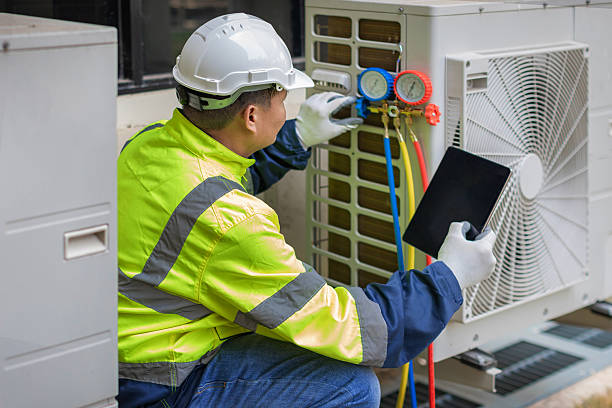 Professional Hvac technician working in Millis, MA